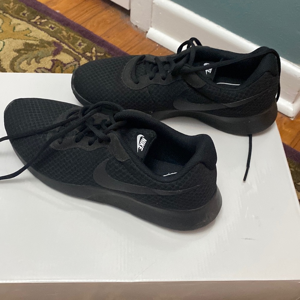 Solid black Nike shoes